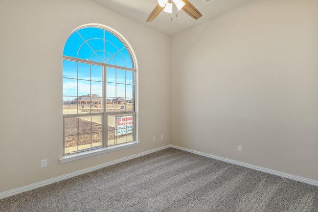 Carpeted spare room with a ceiling fan and baseboards | Image 20