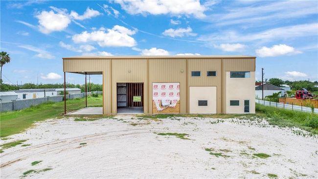 View of property featuring a pole building and a detached garage | Image 23