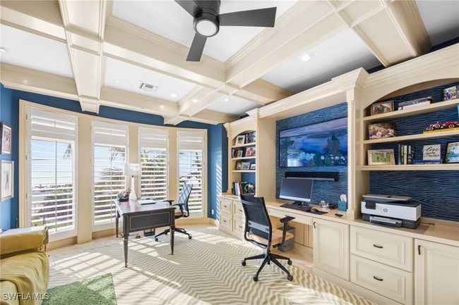 Office with built in desk, and space for a second desk , lovely coffered ceiling, built-in shelving and Gulf views! | Image 24