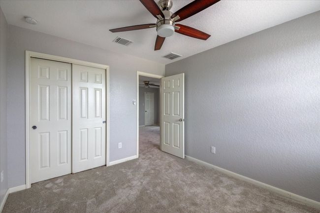 Bedroom upstairs with closet space, new carpet, and ceiling fan! | Image 30