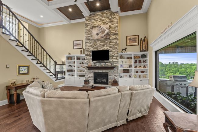Grand stone fireplace with bookshelves. | Image 8