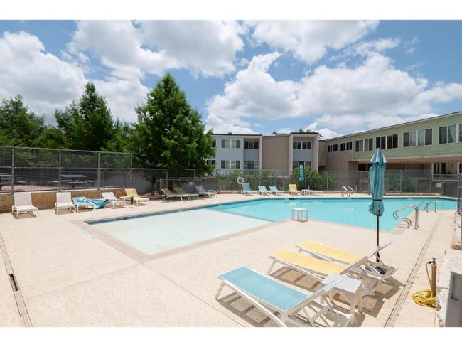 Community pool featuring a patio area | Image 11
