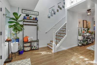 Vinyl plank flooring at the entry flows throughout the main living areas. | Image 3