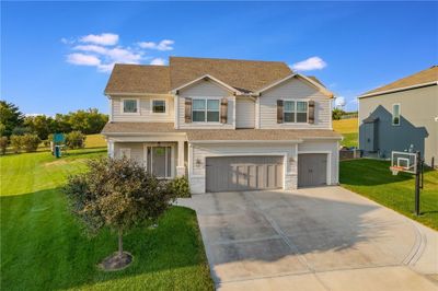 View of front of property with a garage and a front yard | Image 3