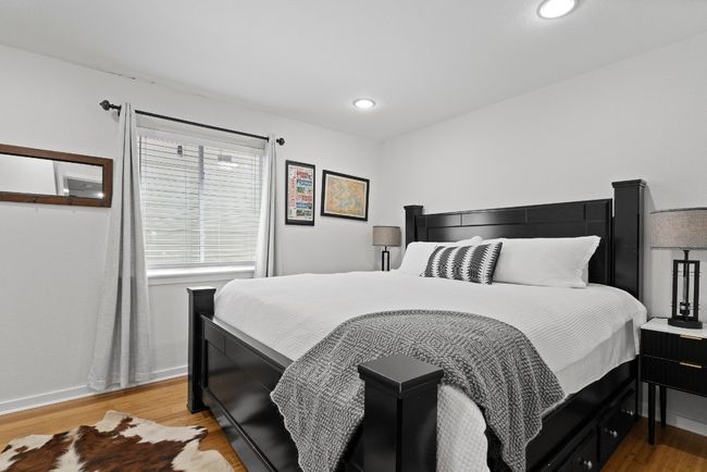 Bedroom featuring light wood-type flooring, baseboards, and recessed lighting | Image 22