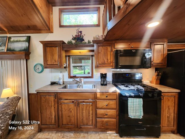 Kitchen with loft overlooking | Image 17