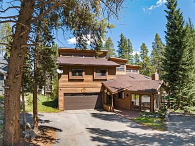 View of front facade with a garage | Image 1