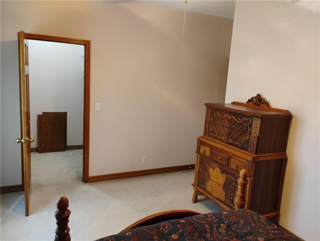 Upstairs Bedroom #1 walk in closet, baseboards and carpet | Image 68
