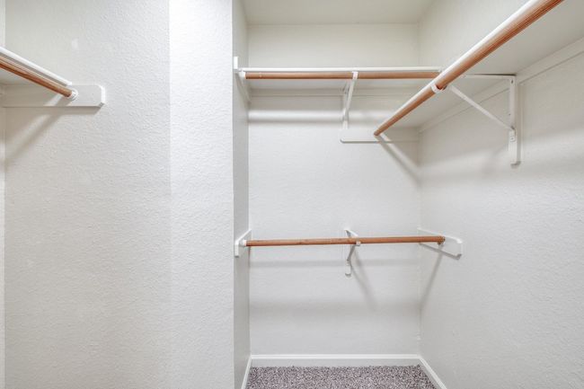 Spacious closet with carpet flooring | Image 19