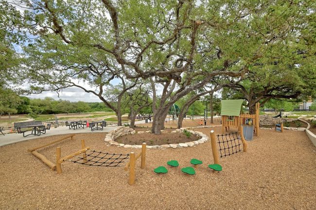 Community playground with picnic area near the pond. | Image 37