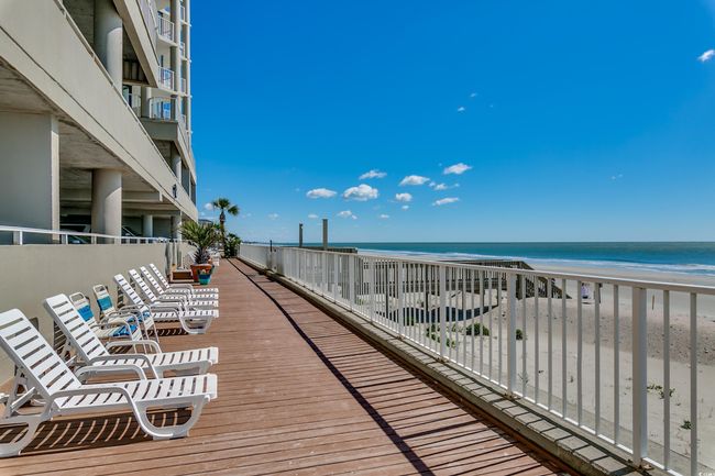 Deck featuring view of water and beach | Image 26