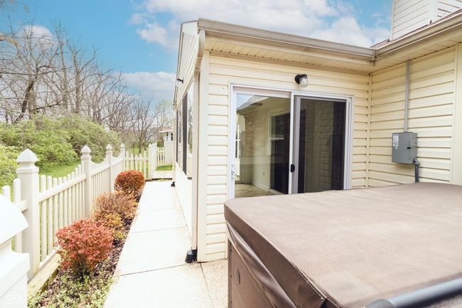 view of patio / terrace with fence and a hot tub | Image 29