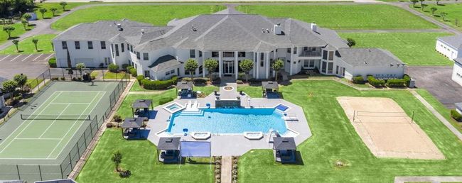 Discover an expansive luxury retreat featuring private tennis courts, a resort-style pool, and extensive grounds perfect for leisure and entertainment. | Image 37