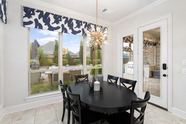 Start your day with a cup of coffee and these views! Upgraded light fixture and plenty of natural light exudes from this space. | Image 16