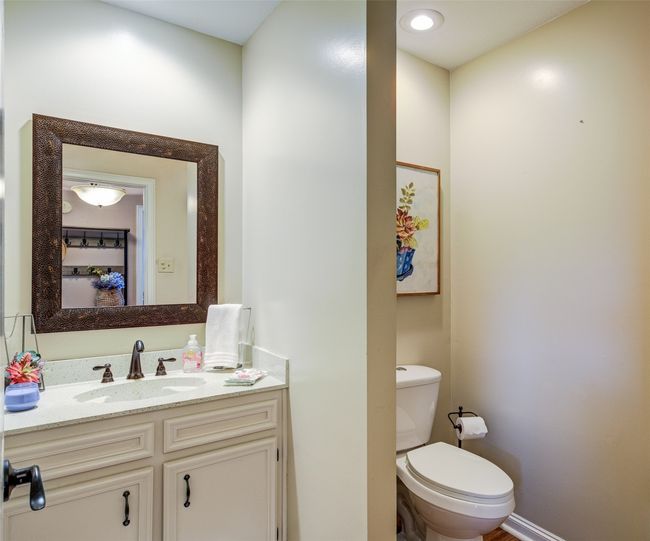 Half bathroom featuring toilet and vanity | Image 14