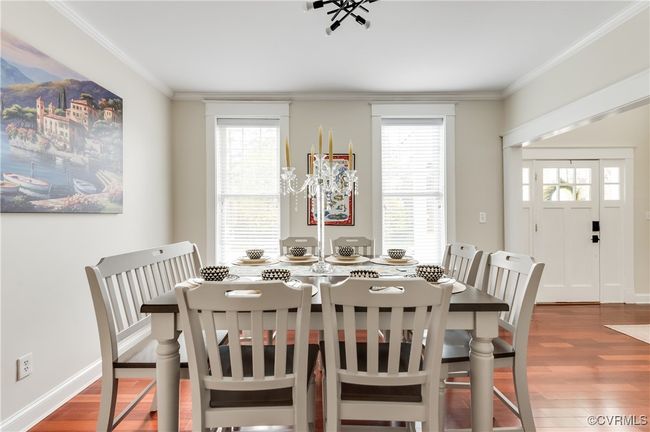 Dining space with crown molding, baseboards, and wood finished floors | Image 10