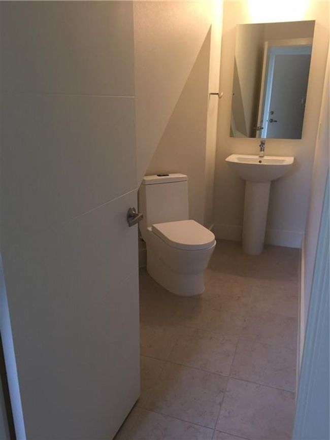 Half bath with toilet and tile patterned flooring | Image 17