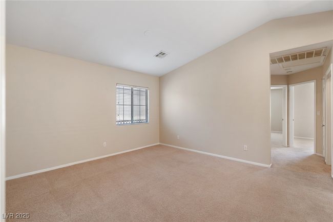 Empty room with light carpet and lofted ceiling | Image 6
