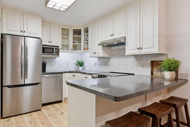 Notice that the microwave is not above the stove; therefore providing a separate kitchen prep space | Image 10