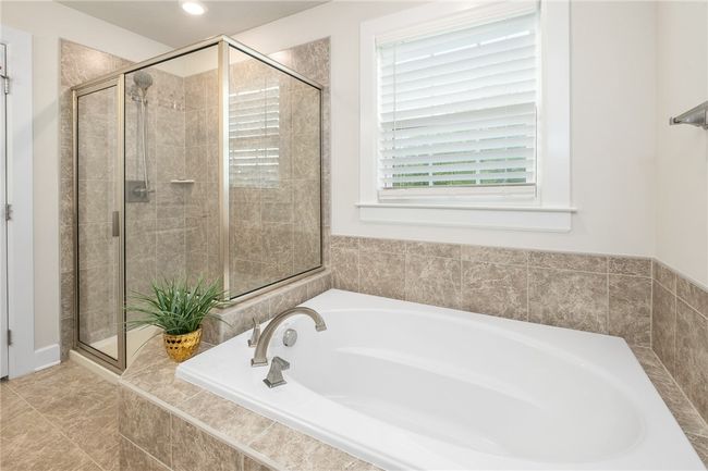 Glass Shower And Soaking Tub In The Primary Bath | Image 22