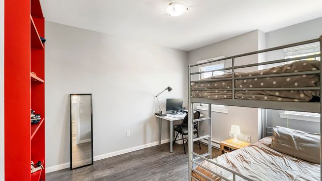 Bedroom featuring wood finished floors and baseboards | Image 23