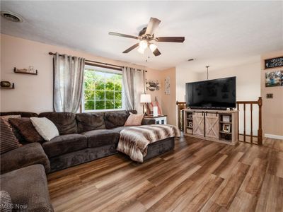 Living room featuring hardwood / wood-style floors and ceiling fan | Image 3