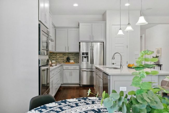 The home chef will enjoy built-in stainless steel appliances - the refrigerator conveys! | Image 15