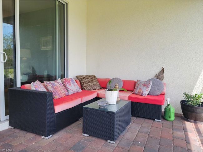 View of patio with an outdoor hangout area | Image 34