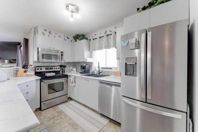 8429 - 304 Mackenzie Way Sw, Home with 2 bedrooms, 2 bathrooms and 2 parking in Airdrie AB | Image 7