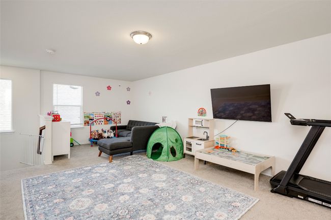 View of carpeted living room | Image 18
