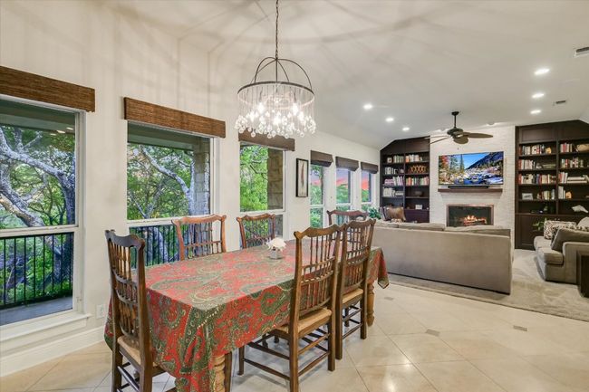 Dining area featuring recessed lighting, tile patterned floors, and a notable chandelier | Image 7
