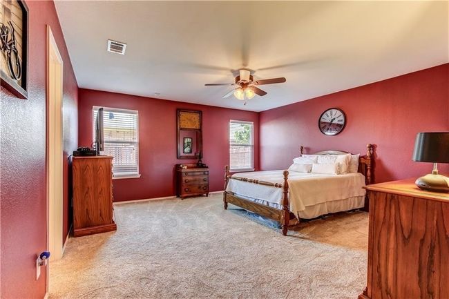 Carpeted bedroom featuring ceiling fan | Image 13