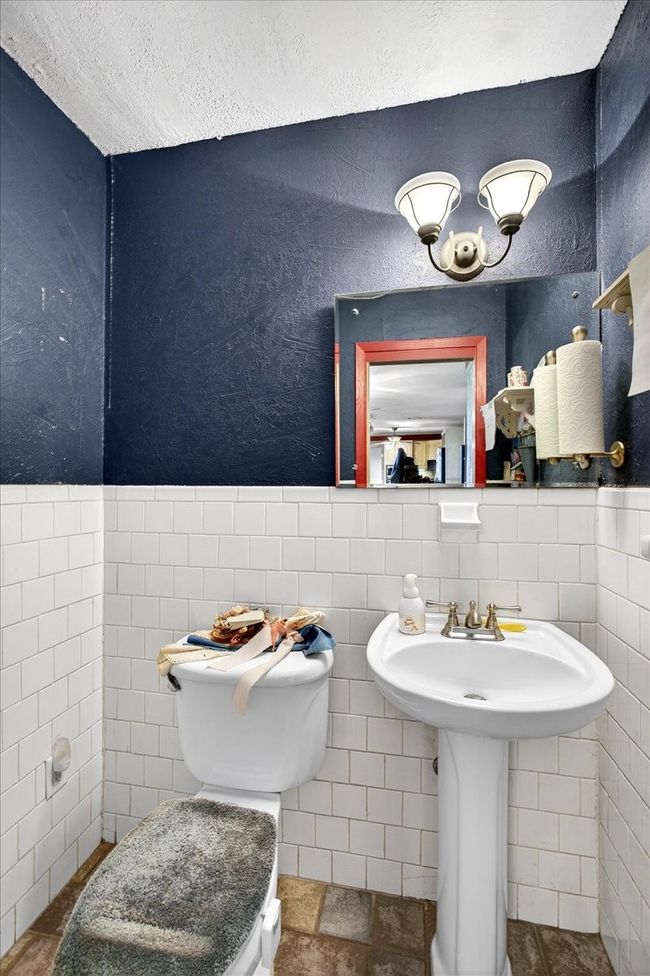 Bathroom with tile walls and wainscoting | Image 30