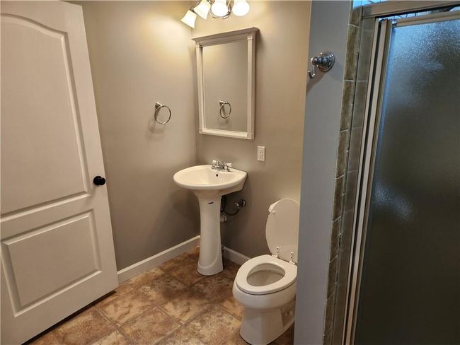 Bathroom featuring an enclosed shower | Image 16