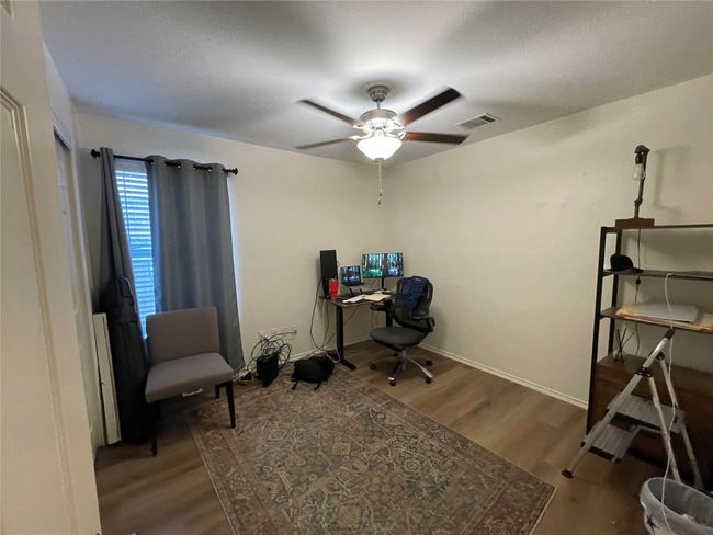 Office area featuring wood finished floors and ceiling fan | Image 4