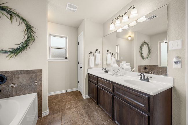 Bathroom with a garden tub and double vanity | Image 18