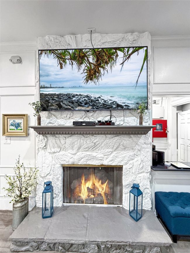Detailed view of a stone fireplace | Image 6