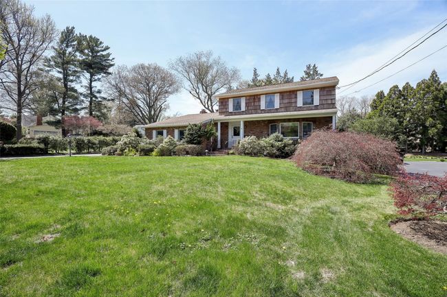 Traditional home with brick siding and a front yard | Image 5