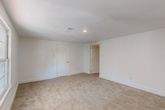 View of carpeted spare room | Image 31