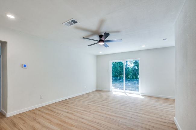 Bathroom featuring wood finished floors, double vanity, and recessed lighting | Image 7