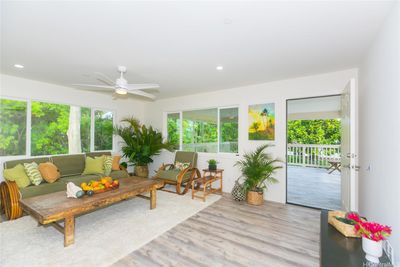 Staged - Upstairs living room looking out to open Lanai Best feature of The Home | Image 2