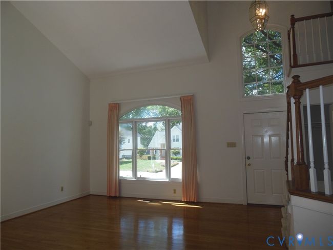 Open Living Room concept with Cathedral Ceiling and wood flooring | Image 4