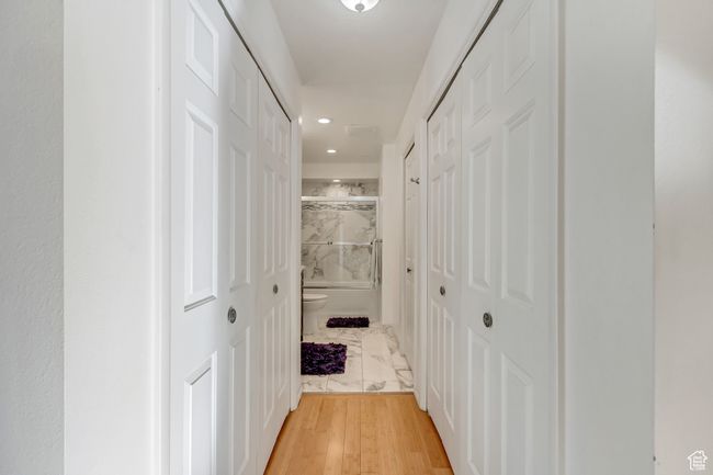 Hall featuring marble finish floor and recessed lighting | Image 13