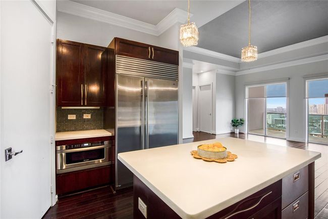 The island makes a great space to entertain guests while preparing your favorite meal! Do you see the cooling drawers to the right of the island? These are wonderful for entertaining, keeping the beverages cool. | Image 13