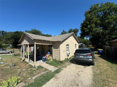 View of side of property with a lawn | Image 1