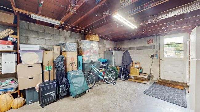 Basement Storage Room featuring Oil Burner, Brand New Oil Tank, Newer Well Pump and Water Softner , entrance to the garage and concrete block walls. | Image 32