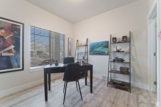 Office with baseboards, visible vents, and wood finished floors | Image 12