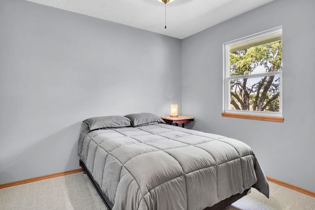Carpeted bedroom with baseboards | Image 17