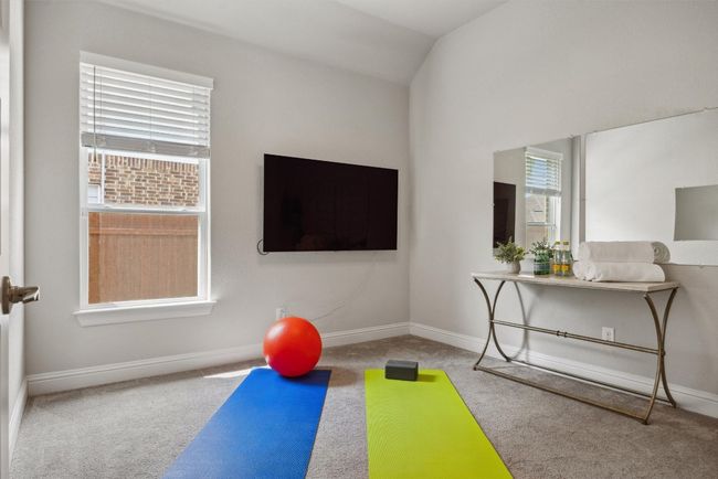 Exercise room featuring carpet flooring and lofted ceiling | Image 17