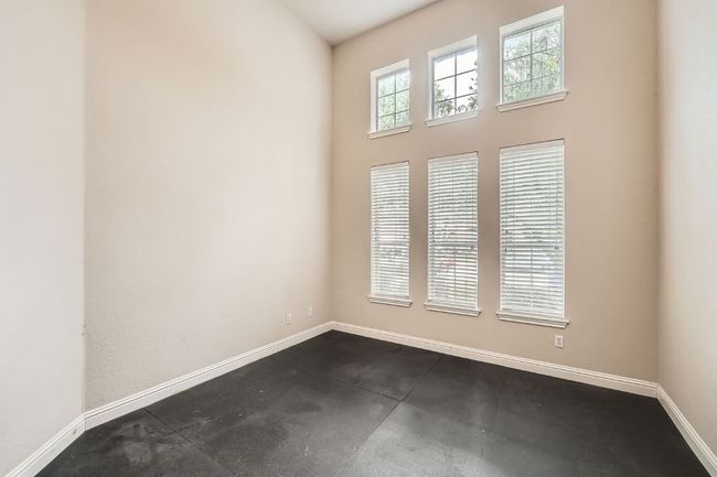 Empty room featuring concrete flooring and baseboards | Image 36